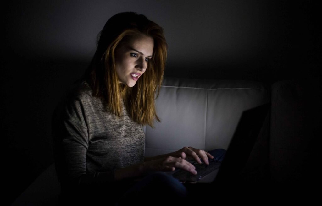 night owl girl working on laptop